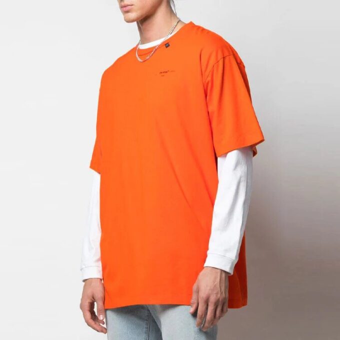 Camiseta oversize de manga corta con bordado de flechas abstractas