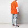 Camiseta oversize de manga corta con bordado de flechas abstractas