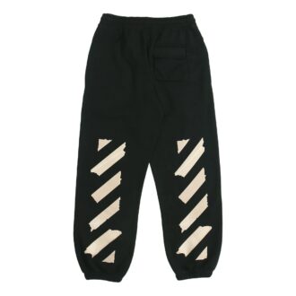 Pantalones deportivos negros con rayas y correa de goma en negro y dorado