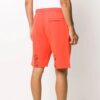 Pantalones deportivos para hombre FW20 con flechas rociadas, color naranja